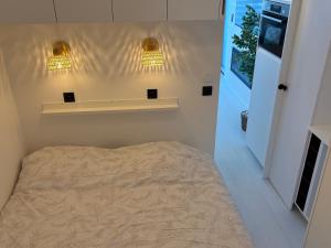 En eller flere senge i et værelse på SEA VIEW Juweeltje