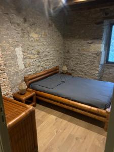 En eller flere senge i et værelse på Le domaine des mortiers appartement T2