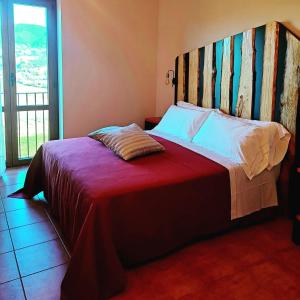 Postel nebo postele na pokoji v ubytování Agriturismo Violati