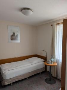 Postel nebo postele na pokoji v ubytování Hotel Am Markt