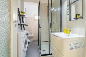 a bathroom with a shower and a sink and a toilet at La palazzina al LINGOTTO in Turin +89 photos