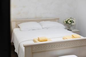 Voodi või voodid majutusasutuse Split Varos Inn toas