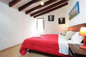 A bed or beds in a room at House Walking Distance to Pollensa by Renthousing