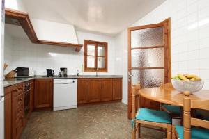 A kitchen or kitchenette at House Walking Distance to Pollensa by Renthousing