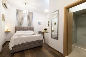 Voodi või voodid majutusasutuse Split Varos Inn toas
