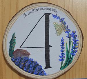 a patch with a peace sign and flowers on it at Affittacamere Porticciolo in Castelnuovo del Garda