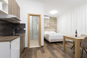 Voodi või voodid majutusasutuse Split Varos Inn toas
