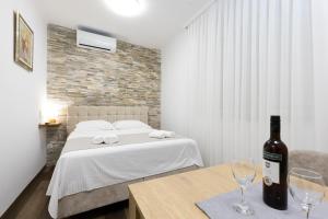 Voodi või voodid majutusasutuse Split Varos Inn toas