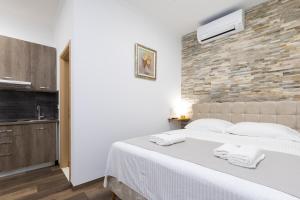 Voodi või voodid majutusasutuse Split Varos Inn toas