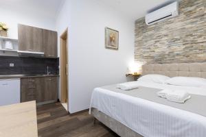 Voodi või voodid majutusasutuse Split Varos Inn toas