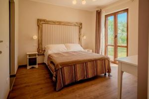 Postel nebo postele na pokoji v ubytování Agriturismo Violati