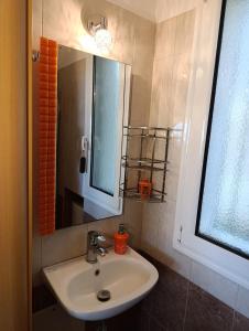 a bathroom with a sink and a mirror at Villa Klelia in Afantou