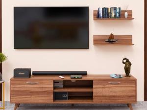 a living room with a television on a wall at VIP GRAND HOTEL- Nearby Trichy Airport & IIM University in Thondamannallūr