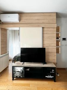 a living room with a flat screen tv on a table at Delete 5 - Zemunske Kapije in Belgrade +52 photos
