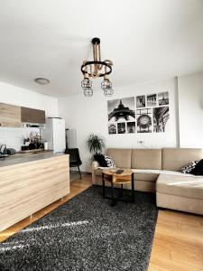 a living room with a couch and a table at Delete 5 - Zemunske Kapije in Belgrade