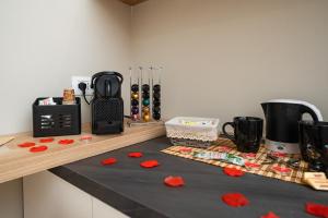 a kitchen counter with red poppers on a counter top at B&B La Camelia Luxury Suite in Terlizzi