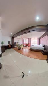 a bedroom with a bed and a living room at The Kris Residence in Patong Beach +227 photos