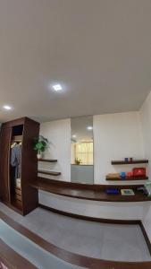a living room with a table and a mirror at Dee Residence Phuket in Patong Beach +272 photos