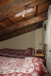 Albergo Diffuso - Rocca Calascioにあるベッド