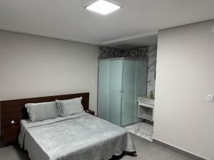 Postel nebo postele na pokoji v ubytování AR Pousada