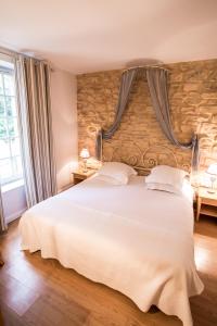 Postel nebo postele na pokoji v ubytování Hôtel Le Pré Galoffre