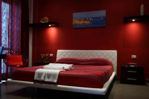 מיטה או מיטות בחדר ב-Palazzo Dei Corsari