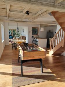 a living room with a pool table in the middle at Merveille du Mont in Météren +25 photos