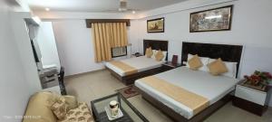 Postel nebo postele na pokoji v ubytování Hotel Su Shree Continental Dx Near New Delhi Railway Station