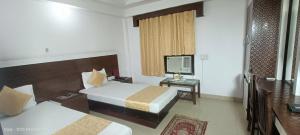 Postel nebo postele na pokoji v ubytování Hotel Su Shree Continental Dx Near New Delhi Railway Station