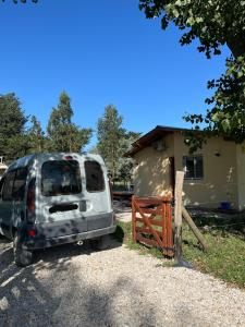 a silver van parked in front of a house at Casita Amarilla in Miramar