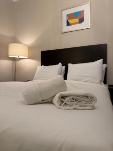 Postel nebo postele na pokoji v ubytování Green Ariana Hotel - near Wembley and central London