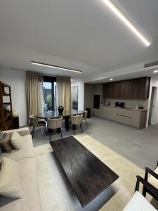 a living room with a couch and a table at Casa Amayuma - Málaga Centro Histórico in Málaga