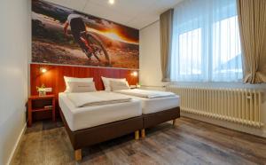 Letto o letti in una camera di Hotel Winterberg Resort
