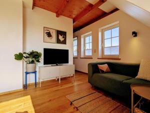 TV a/nebo společenská místnost v ubytování Gemütliche Wohnung an der Nordseeküste in Utgast