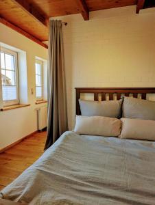 Postel nebo postele na pokoji v ubytování Gemütliche Wohnung an der Nordseeküste in Utgast