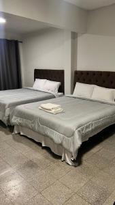 Postel nebo postele na pokoji v ubytování Hotel Herrera