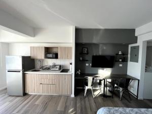 Η κουζίνα ή μικρή κουζίνα στο Apartamentos CAICHAN