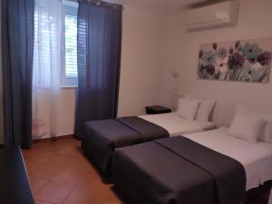 Postel nebo postele na pokoji v ubytování Viola rooms