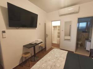 TV a/nebo společenská místnost v ubytování Viola rooms
