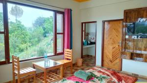 Телевизор и/или развлекательный центр в Kasar Wonder Hill Homestay