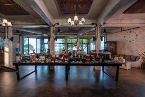 a large room with a large table with flowers on it at Koh Mak White Sand Beach in Ko Mak
