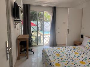 Katil atau katil-katil dalam bilik di Maison Mimosa