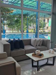 a living room with a couch and a coffee table at Casa de Porch in Manila
