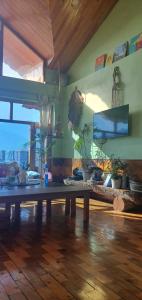 a room with a wooden table with plants on it at BohOdyssey Hallan a Traditional Village Stay with Panoramic Mountain Views in Nagar