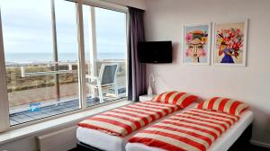 Postel nebo postele na pokoji v ubytování Hotel B&B Seahorse