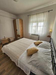 Postel nebo postele na pokoji v ubytování Apartments Plejic