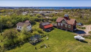 an aerial view of a house and a barn at Charming Bohuslän Cottage with Nature Views in Lysekil
