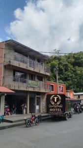 a hotel with a truck parked in front of it at Hotel Talauta Resort in Talauta