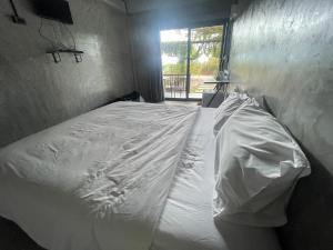 Voodi või voodid majutusasutuse Por Sampao Camp&Resort toas