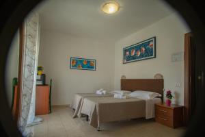 Postel nebo postele na pokoji v ubytování Hotel Ariston